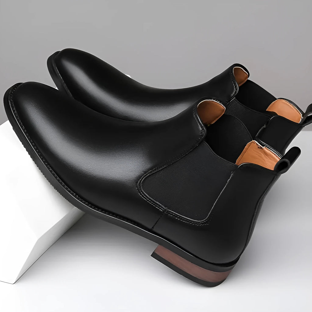 Men's black and light brown pointed toe Chelsea boots with a low heel and artificial PU upper