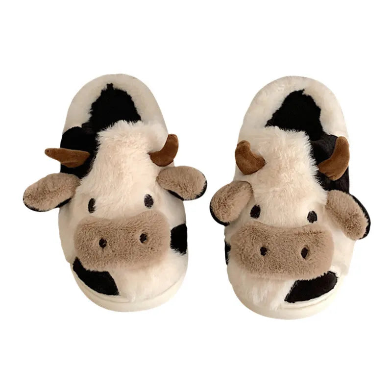 White cow animal house slippers with black spots, plush lining, and textured non-slip sole