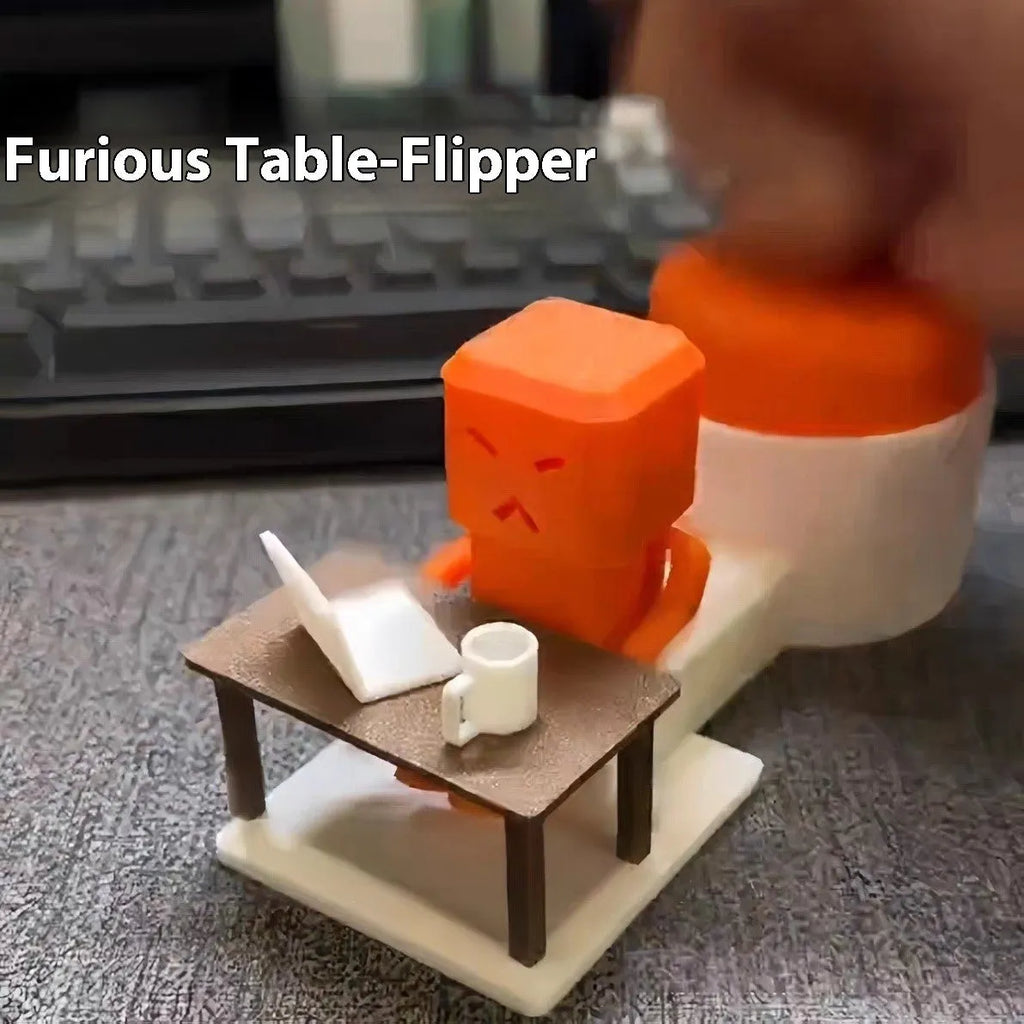 Orange plastic rotating decompression toy on a desk, showing its 16cm length.
