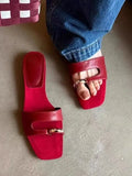 Leather upper outdoor slipper with square scaffolding toe and rubber sole in black, red, silver, and white.
