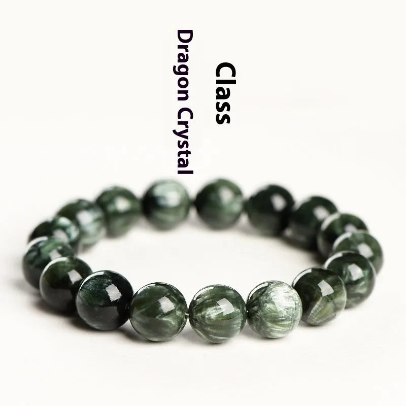 Green Dragon Crystal bracelet with round beads and a central Ruyi knot on a wrist.