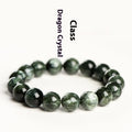 Green Dragon Crystal bracelet with round beads and a central Ruyi knot on a wrist.