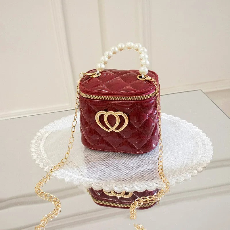 White PVC bucket handbag with a heart-shaped pattern