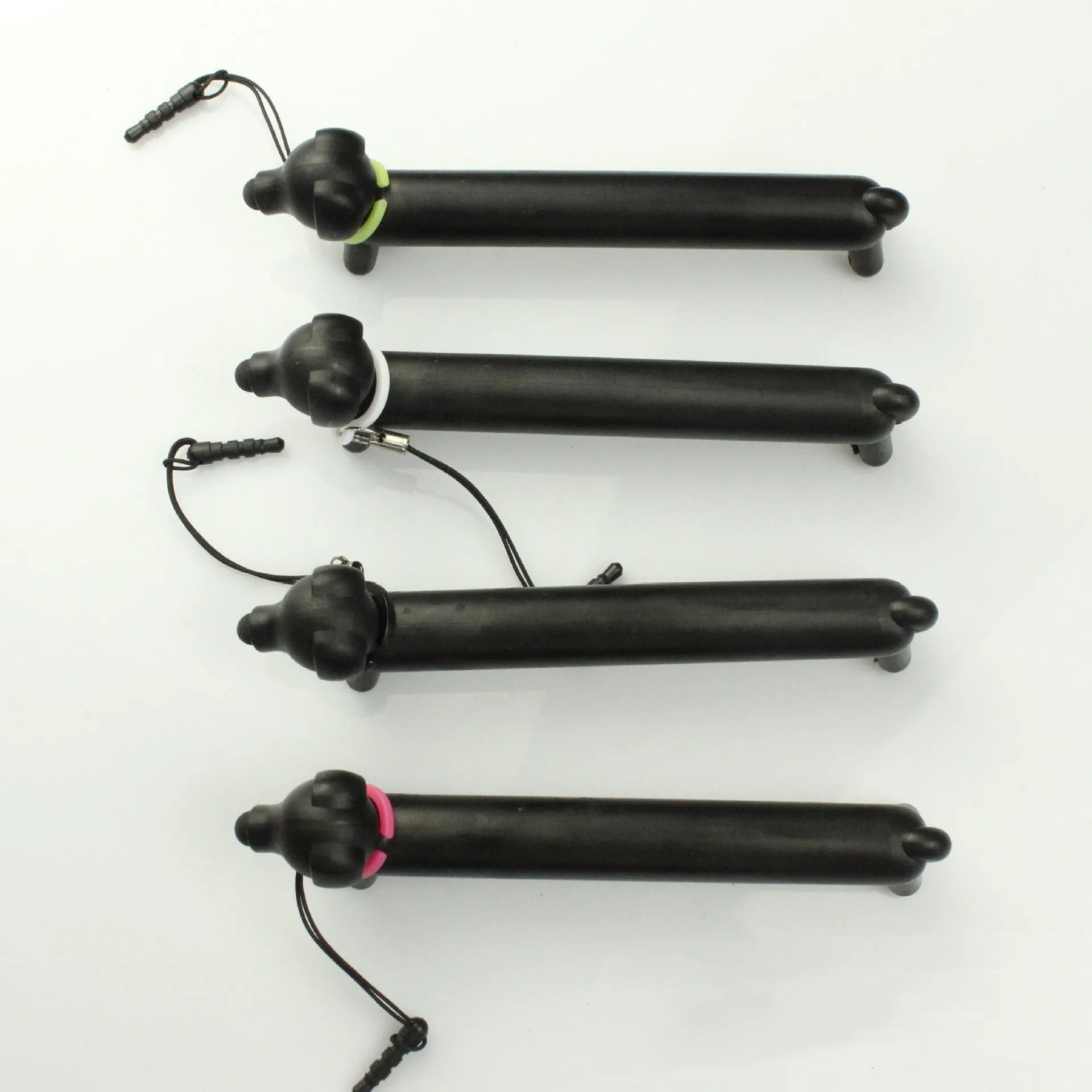 Black puppy-shaped touch screen stylus pen shown in dual-length positions with phone holder function