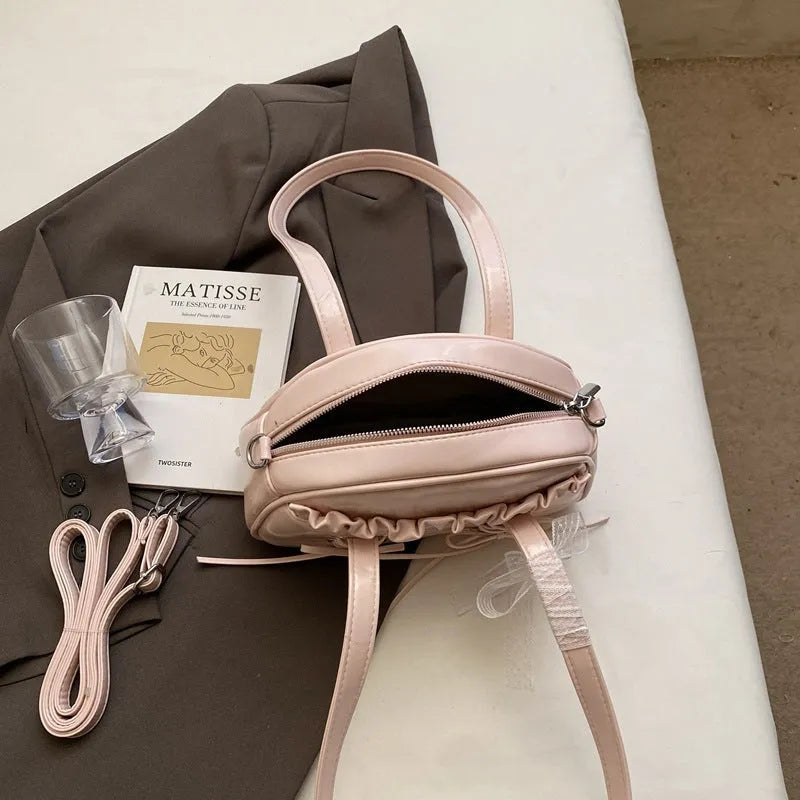 Women's bandage bow design PU leather shoulder handbag with mobile phone compartment in milky white colour