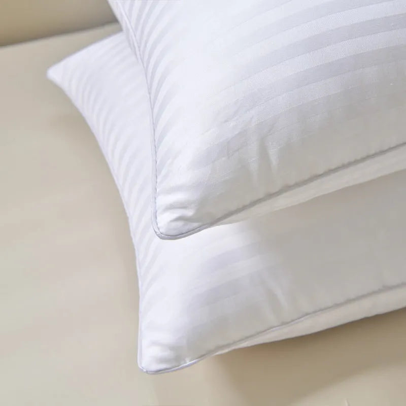 White hotel cotton satin stripe feather pillow showing 2cm stripe detail, shown in three sizes.