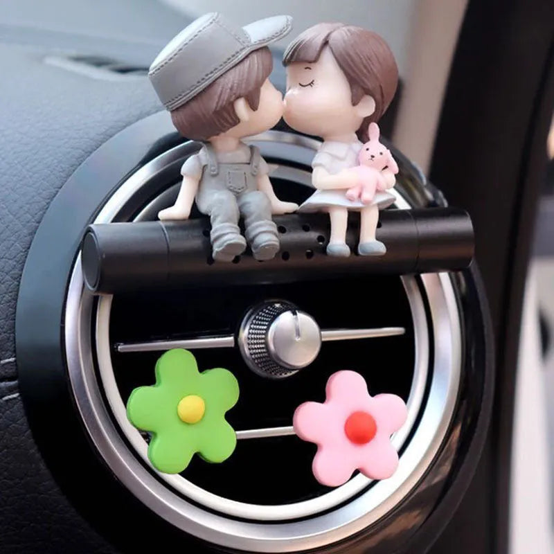 Cartoon couple car air outlet perfume clip in PVC and metal with included aroma stick, grey or blue option