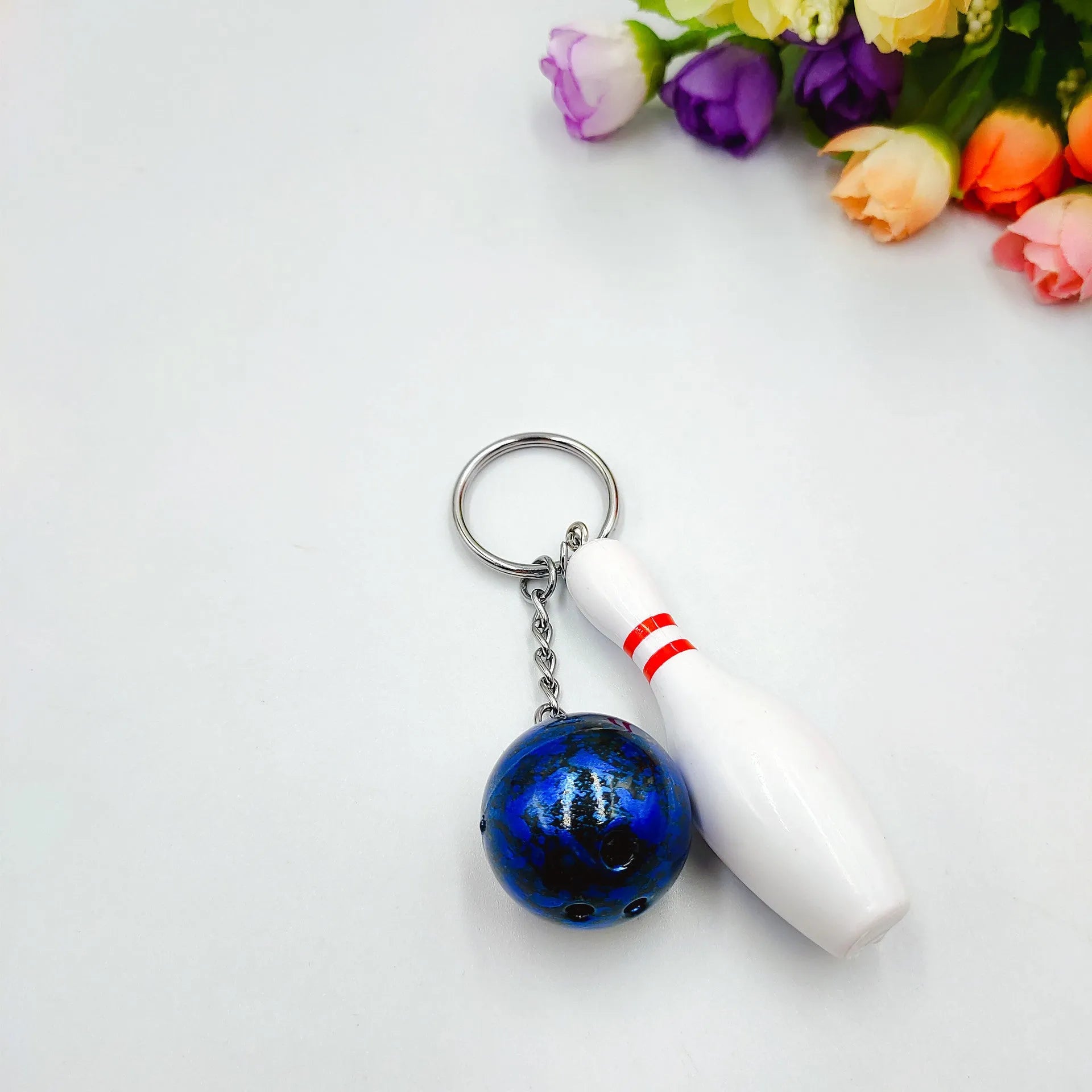 Mini simulation bowling ball keychain pendant with metal clip in blue, red, purple, and green colours