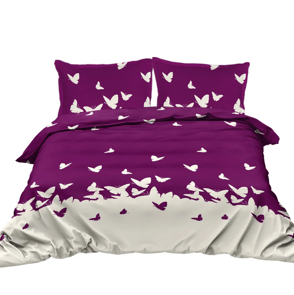 Purple butterfly reversible microfiber comforter set with two pillow shams on bed