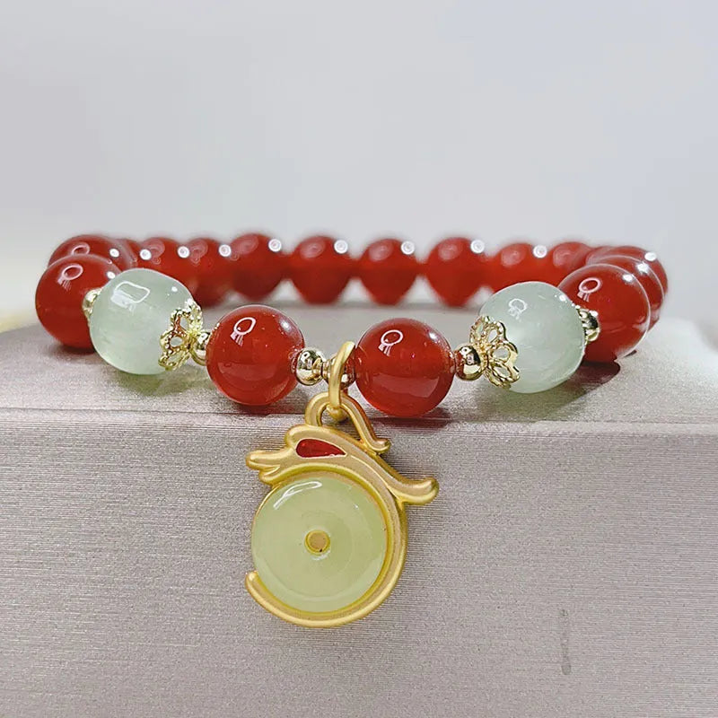 Red agate bracelet with Chinese lucky bag design and dragon motifs for women