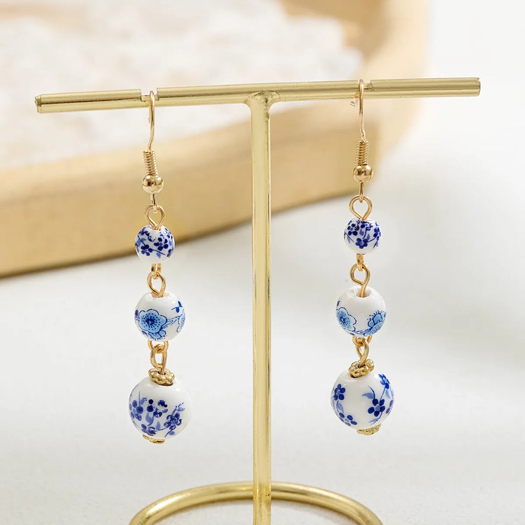 Blue and white porcelain ceramic bead geometric retro earrings with alloy electroplated finish