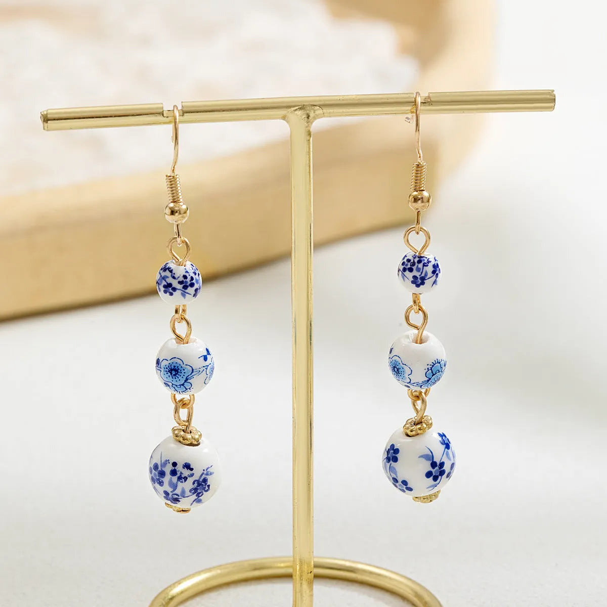 Blue and white porcelain ceramic bead geometric retro earrings with alloy electroplated finish