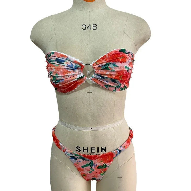Floral print blue bikini tube top with lace trim and backless design for swimming.