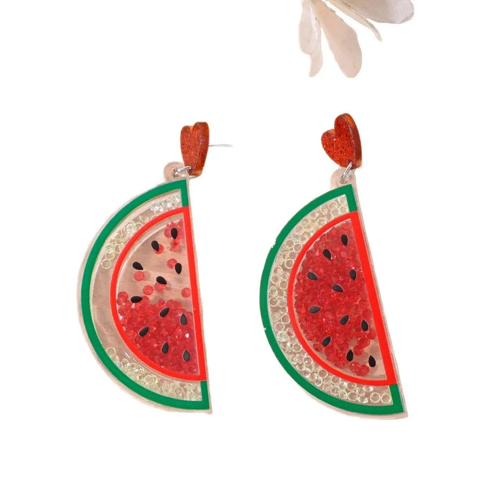 Acrylic drop earrings shaped like a strawberry, cherry, watermelon, pineapple, cake, ice cream, and coconut tree on a white background.