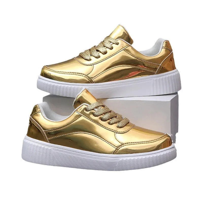 Gold sequinned platform sneaker with round toe and thick MD sole on a white background