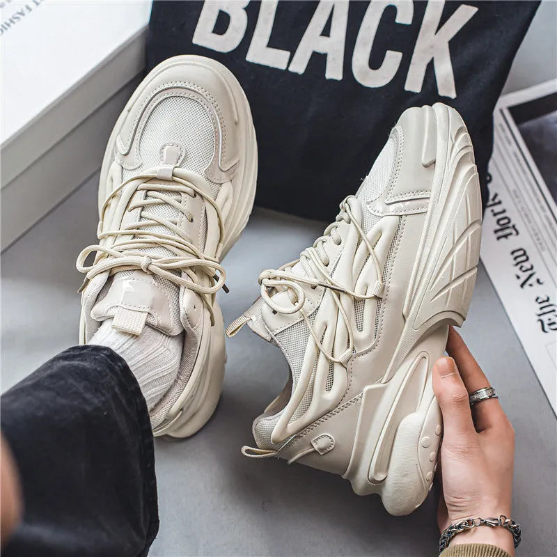 Men's low-top sneaker in beige with mesh and PU leather upper, round toe, platform heel, and lace-up front.